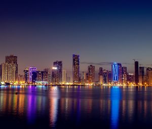 Preview wallpaper night city, skyscrapers, buildings, water, reflection