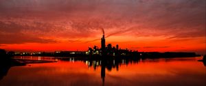 Preview wallpaper night city, sunset, sky, factory, horizon