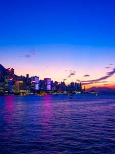 Preview wallpaper night city, sunset, skyscrapers, beach