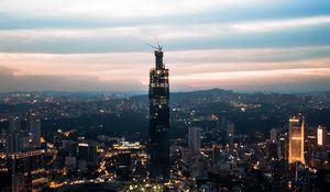 Preview wallpaper night city, tower, buildings, lights, dusk