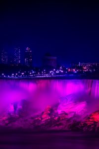 Preview wallpaper night city, waterfall, lights, stones, architecture, buildings