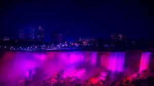 Preview wallpaper night city, waterfall, lights, stones, architecture, buildings