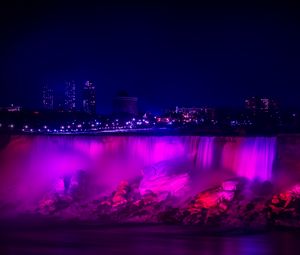 Preview wallpaper night city, waterfall, lights, stones, architecture, buildings