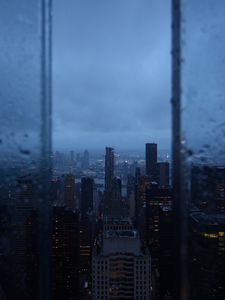 Preview wallpaper night city, window, rain, skyscrapers, aerial view