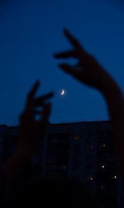 Preview wallpaper night, moon, dark, hands, building