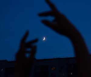 Preview wallpaper night, moon, dark, hands, building