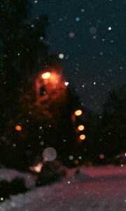 Preview wallpaper night, snow, glare, blur, bokeh