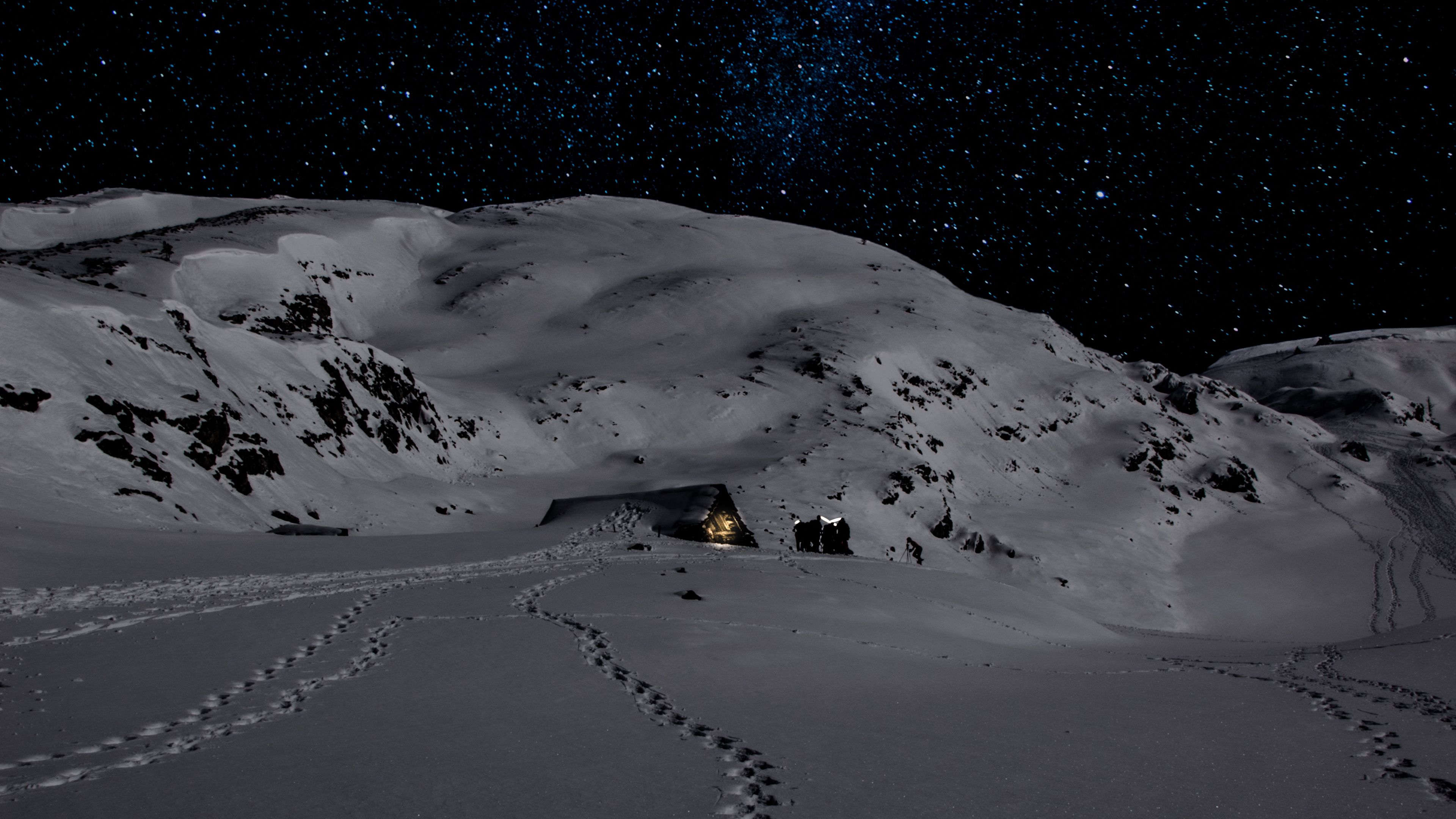 3840x2160 Wallpaper night, snow, mountains, footprints, winter