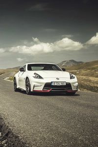 Preview wallpaper nissan, 370z, hills, road, side view