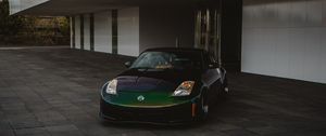 Preview wallpaper nissan, car, sports car, front view, building