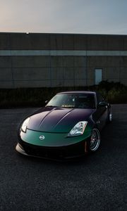 Preview wallpaper nissan, car, sports car, front view, headlights, building