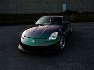 Preview wallpaper nissan, car, sports car, front view, headlights, building