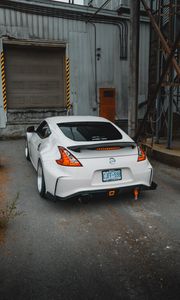 Preview wallpaper nissan, car, sports car, rear view, garage