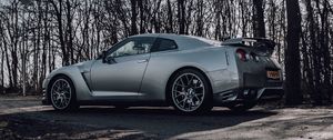 Preview wallpaper nissan gt-r, nissan, car, gray, trees, road