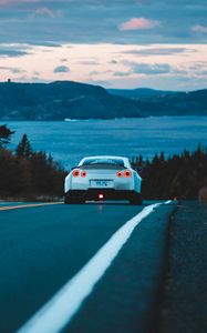 Preview wallpaper nissan gt-r, nissan, rear view, road, movement