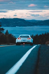 Preview wallpaper nissan gt-r, nissan, rear view, road, movement