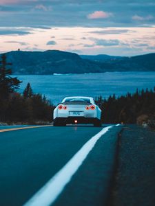 Preview wallpaper nissan gt-r, nissan, rear view, road, movement