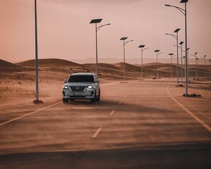 Preview wallpaper nissan, suv, car, road, desert