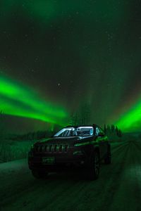 Preview wallpaper northern lights, car, starry sky, road, winter