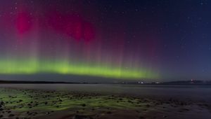 Preview wallpaper northern lights, coast, sand, pebbles, sea