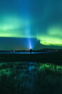 Preview wallpaper northern lights, man, night, glow, flashlight