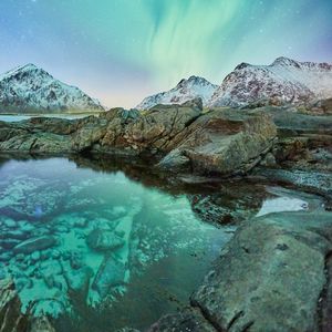 Preview wallpaper northern lights, mountains, rocks, lake, snowy