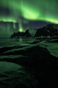 Preview wallpaper northern lights, mountains, shore, snow