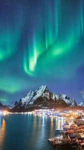 Preview wallpaper northern lights, mountains, snow, snowy, coast, houses