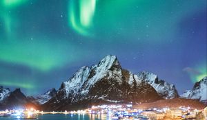 Preview wallpaper northern lights, mountains, snow, snowy, coast, houses