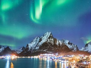 Preview wallpaper northern lights, mountains, snow, snowy, coast, houses