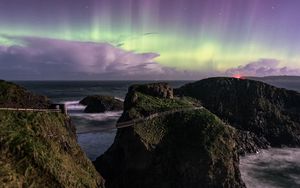 Preview wallpaper northern lights, rocks, bridge, sea, storm