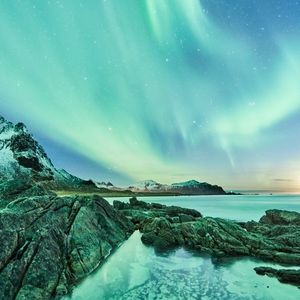 Preview wallpaper northern lights, rocks, lake, starry sky, stars