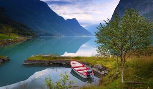 Preview wallpaper norway, boat, mountains, blue water, lake, coast, stones, grass