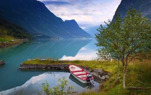 Preview wallpaper norway, boat, mountains, blue water, lake, coast, stones, grass