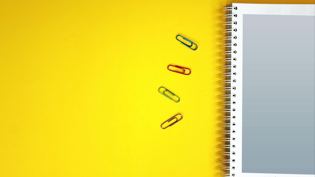 Wallpaper notebook, paper clips, surface, yellow