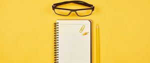 Preview wallpaper notepad, glasses, paper clip, pencil, yellow