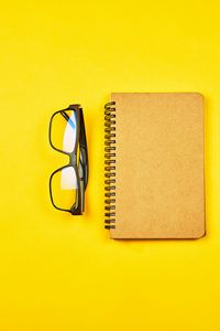 Preview wallpaper notepad, glasses, yellow