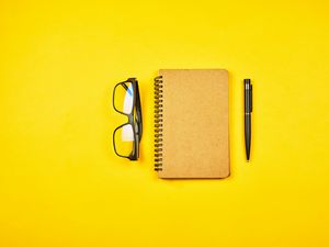 Preview wallpaper notepad, glasses, yellow