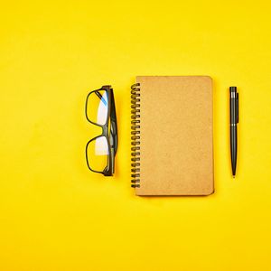 Preview wallpaper notepad, glasses, yellow