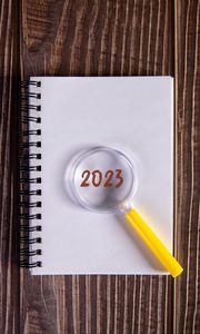 Preview wallpaper notepad, magnifying glass, 2023, wood, new year