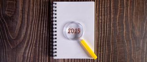 Preview wallpaper notepad, magnifying glass, 2023, wood, new year