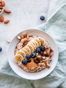 Preview wallpaper oatmeal, berries, fruits, nuts, breakfast