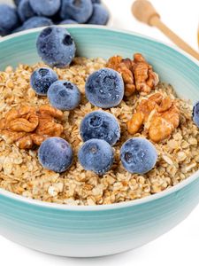 Preview wallpaper oatmeal, berries, nuts, bowl, breakfast