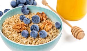 Preview wallpaper oatmeal, berries, nuts, bowl, breakfast