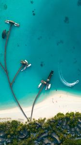Preview wallpaper ocean, aerial view, coast, bungalow, palm trees