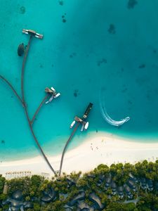 Preview wallpaper ocean, aerial view, coast, bungalow, palm trees