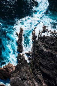 Preview wallpaper ocean, aerial view, rocks, surf, foam, waves, water