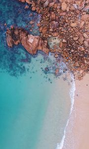 Preview wallpaper ocean, aerial view, stones, water, sand