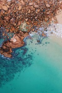 Preview wallpaper ocean, aerial view, water, stones, sand, foam