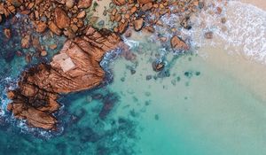 Preview wallpaper ocean, aerial view, water, stones, sand, foam